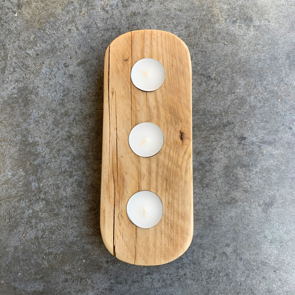Reused wood made in to a tea light holder to hold three tea lights