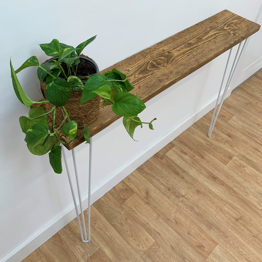 Scaffold board table and hairpin legs with plant