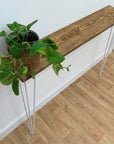 Scaffold board table and hairpin legs with plant