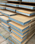 New Scaffold Board with end bands in a stack