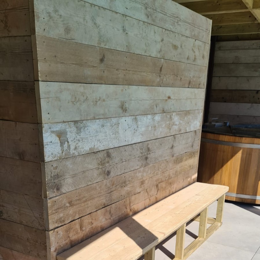 Scaffold boards used for cladding garden room