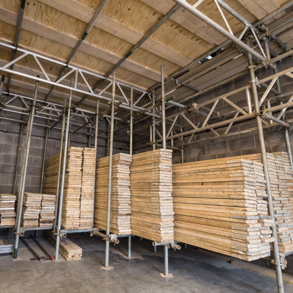 Scaffold boards stacked by size at The Scaff Shop