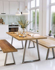 Industrial strength trapezium table legs in kitchen with table and benches