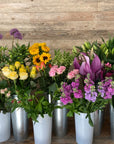 Pallet wood cladding behind flower display